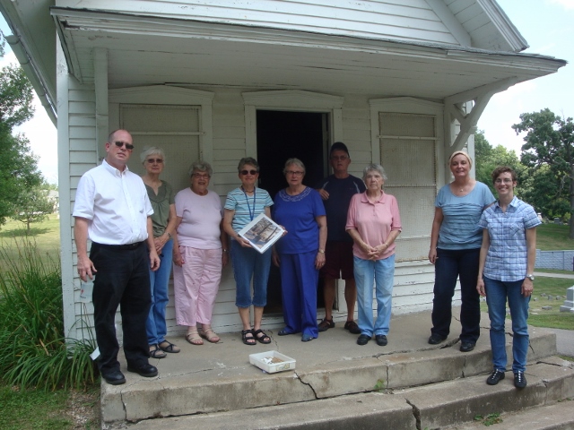 cemetery volunteers at shed