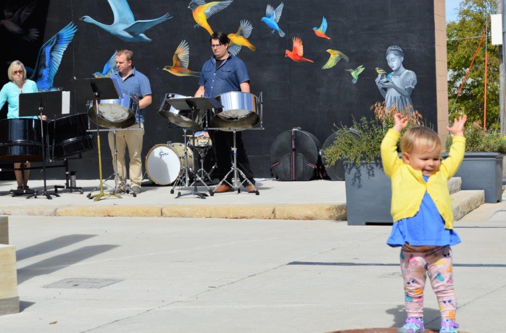 girl dancing to steel drum band