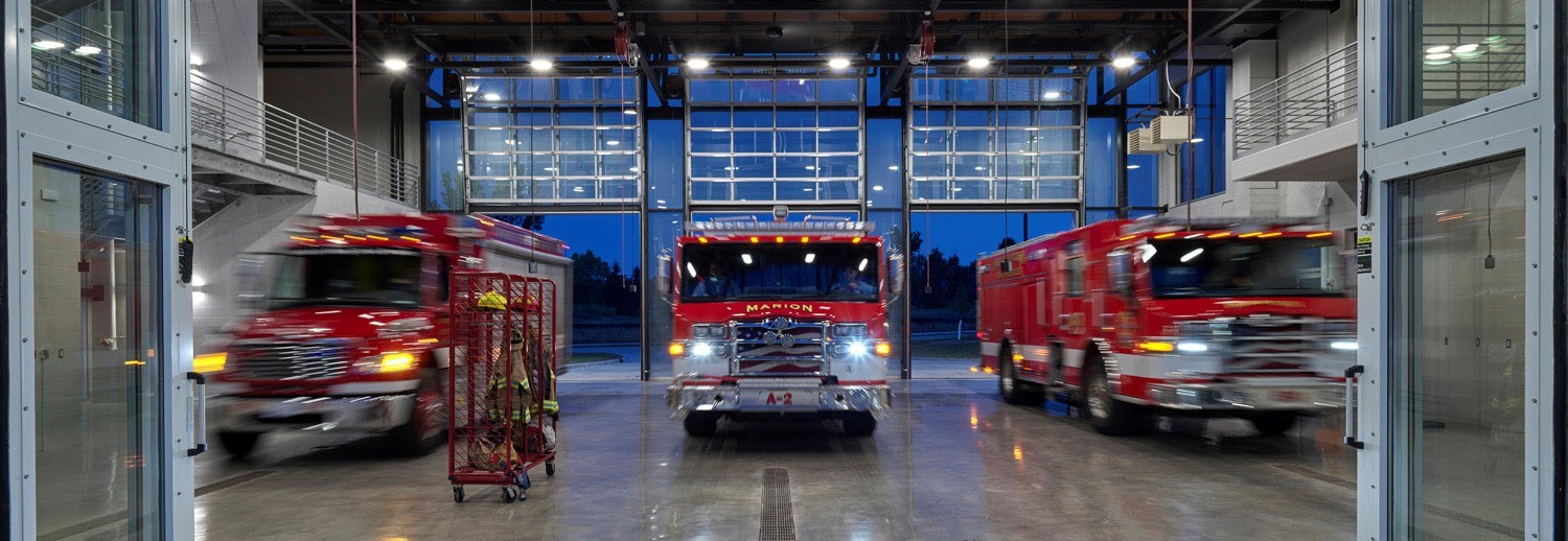 three fire trucks in apparatus bay