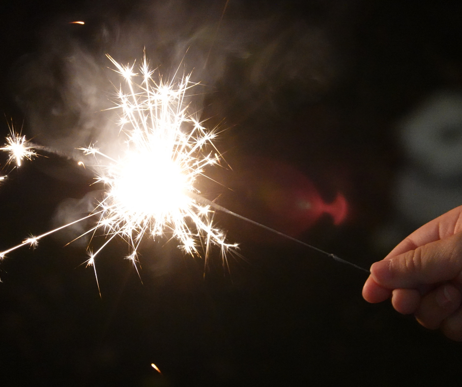 person holding sparkler